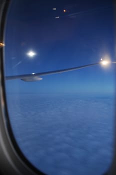 Aerial view of Clouds through flight window