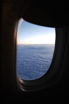 Aerial view of Clouds through flight window