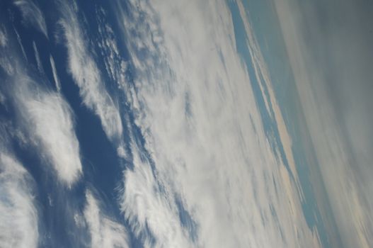 Aerial view of Clouds through flight window