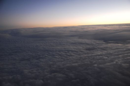 Aerial view of Clouds through flight window