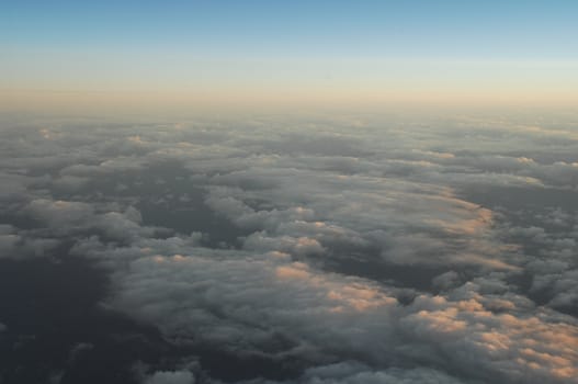 Aerial view of Clouds through flight window