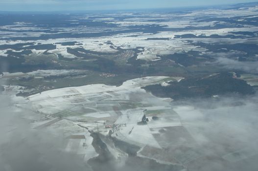 Aerial view of Clouds through flight window