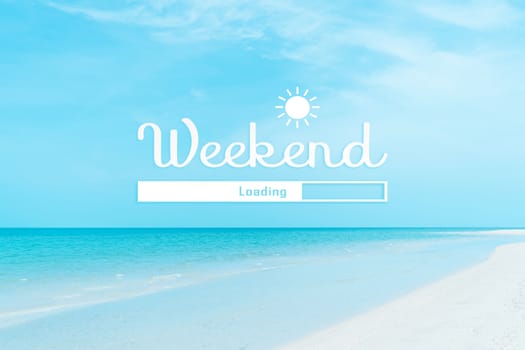 Weekend loading qoute on nature blue sky summer tropical beach. Travel tourism season concept background.