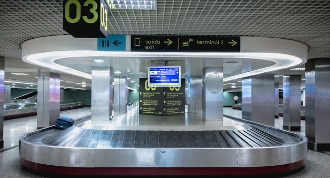 Lisbon, Portugal - August 7, 2018: View of luggage treadmill in Lisbon International Airport on arrival on a summer day