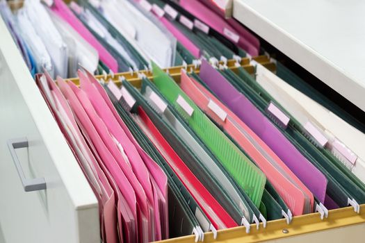Files document of hanging file folders in a drawer in a whole pile of full papers, at work office, Business Concept Office document storage