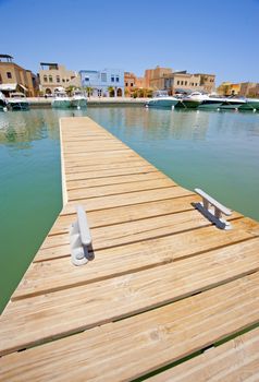 Small private wooden jetty in a tropical marina