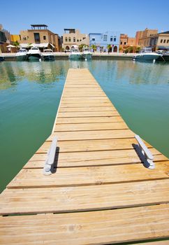 Small private wooden jetty in a tropical marina
