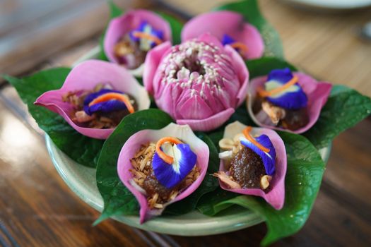 Thai Food-Miang Kham Petal of Lotus Flower Wraps with sauce Thai ancient dish.