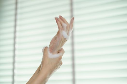 Washing hands with soap. For killing germs, bacteria and virus.