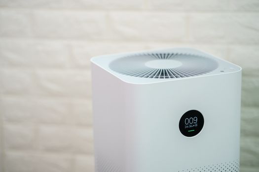 Closeup of Air purifier with monitor screen, show air quality in the room. PM2.5 concept.