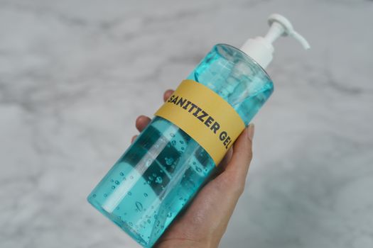 Hands with sanitizer gel pump dispenser. Transparent sanitizer in pump bottle, for killing germs, bacteria and virus.