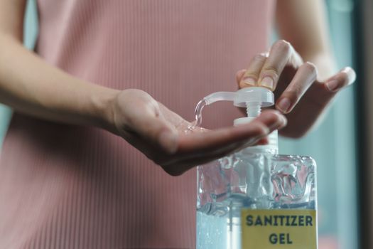 Hand wash with disinfectant gel dispenser during the epidemic covid-19.