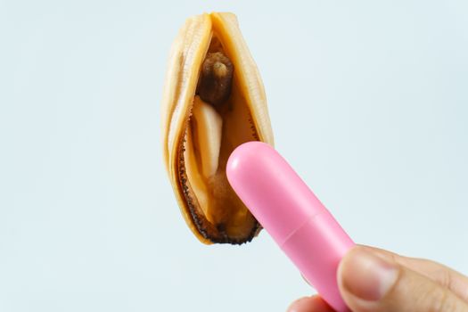 vagina symbol, mussel and pink vibrating sex toy on white background. Concept masturbation