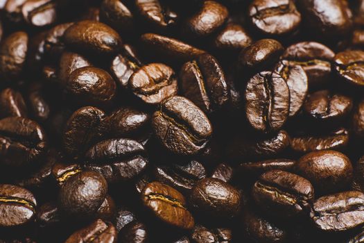 Roasted coffee beans pile background