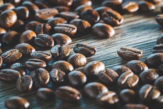 Coffee beans. On a wooden background.