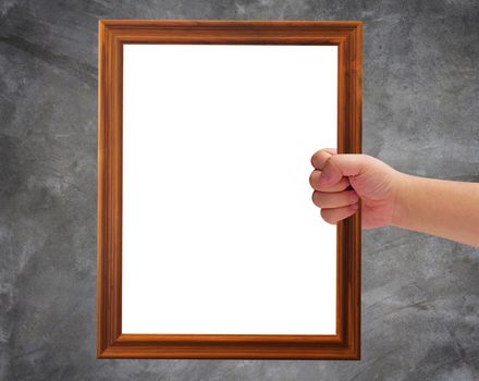 Communication and announcement concept, hand holding wooden frame on concrete background