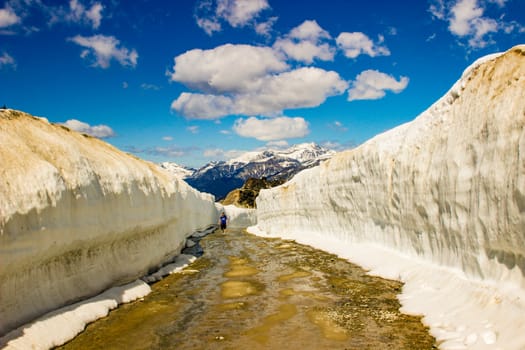 Summer snow walls in Whistler. Road through snow walls. Hiking in summer in British Columbia. beautiful