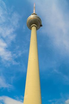 Television tower against the blue sky with clouds in Berlin, Germany