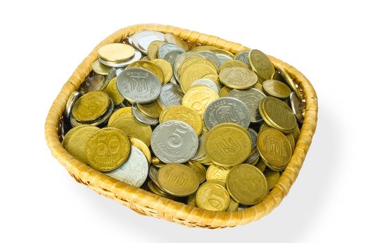 Many ukrainian kopeks, hryvnia cents, in a little basket, isolated on white background