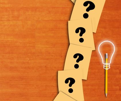 Business solution, problem concept, yellow paper ,pencil and light bulb on wood background 