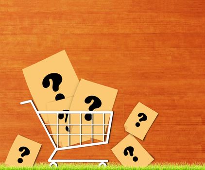 Business solution, problem concept, yellow paper and trolley on wood background