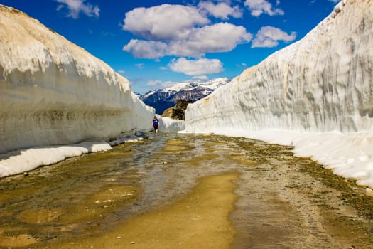 Summer snow walls in Whistler. Road through snow walls. Hiking in summer in British Columbia. beautiful