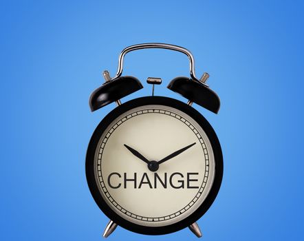 Business time to change concept, alarm clock on blue background