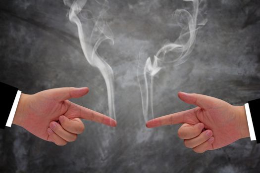 Business competition concept, hand gun and smoke fighting each other