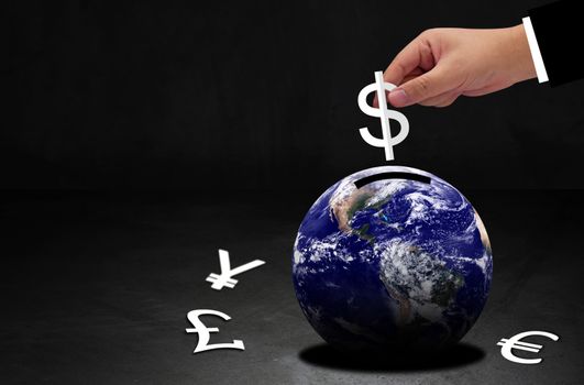 World currency concept, global financial success, hand of business man holding white paper cut dollar symbol and earth, Elements of this Image Furnished by NASA
