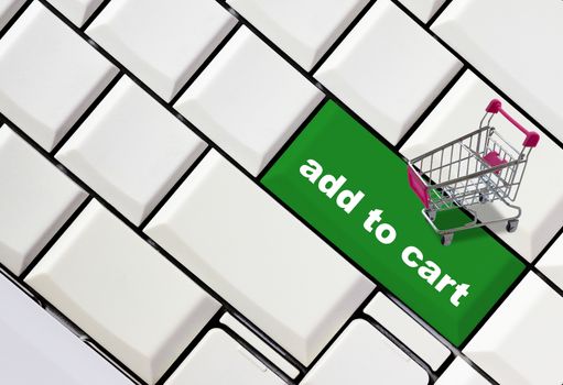Online shopping concept, business global network, shopping trolley on computer keyboard background