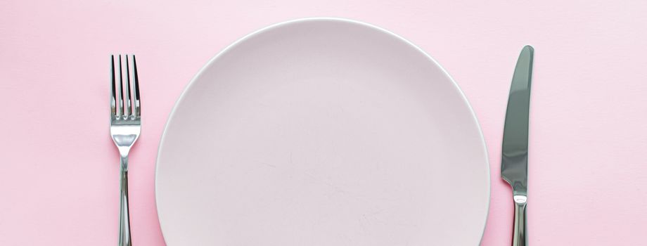 Empty plate and cutlery as mockup set on pink background, top tableware for chef table decor and menu branding design