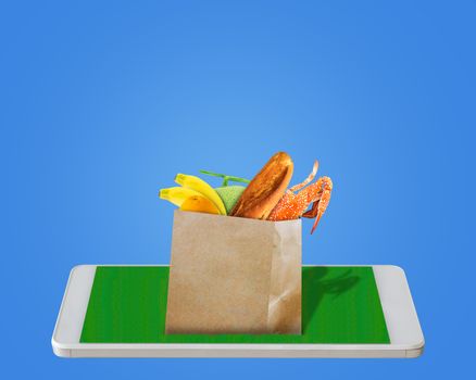 Online shopping concept, mobile phone and product on blue background