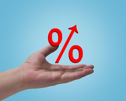 Hand and interest rate symbol on blue background, business financial  concept