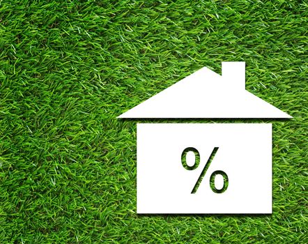 White house and interest rate symbol on green grass background, business financial  concept