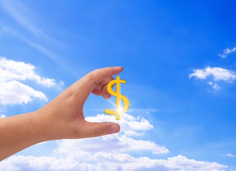 Financial planning and strategy concept, business investment, hand holding gold currency on blue sky background