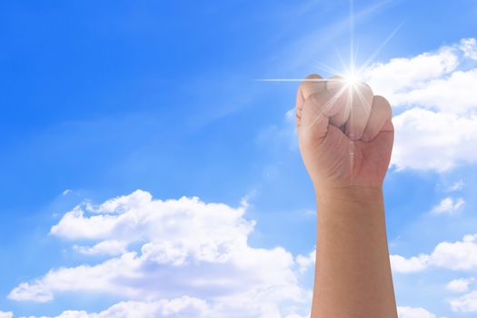 Motivation and inspiration concept, hand on blue sky background