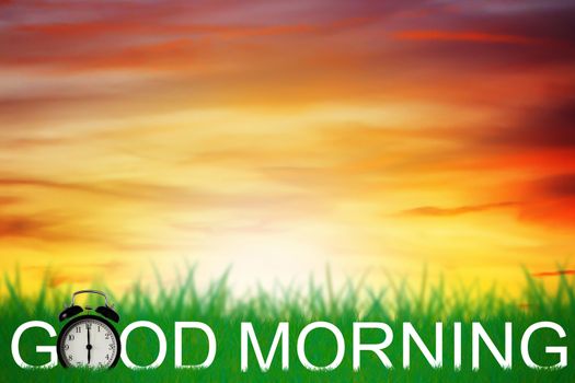 Good morning and wake up concept, alarm clock on green grass