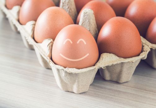 Happiness concept, egg smile on vintage background