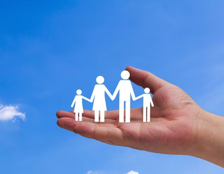 Insurance concept, security life, hand and family paper on blue sky background