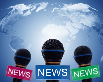 News concept, microphone on blue world map background, Elements of this image furnished by NASA