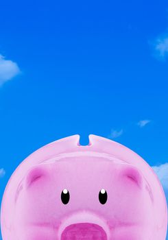 Financial, saving money concept, pink piggy bank on blue sky background with copy space