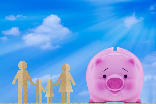 Financial, saving money concept, pink piggy bank on blue sky background, family life