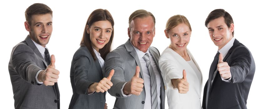 Successful smiling business team with thumbs up isolated over a white background