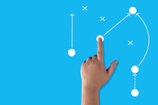 Business strategy and planning concept, hand and direction icon on blue background