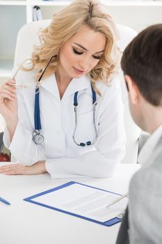 Female doctor and patient reading contract at pad. Physical agreement form signature, disease prevention, ward round reception, consent contract sign, prescribe remedy, healthy lifestyle concept