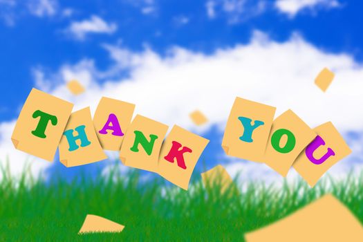 Word thank you concept on green grass and blue sky
