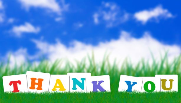 Word thank you concept on green grass and blue sky