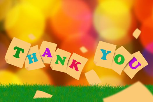 Word thank you concept on green grass and blur bokeh background