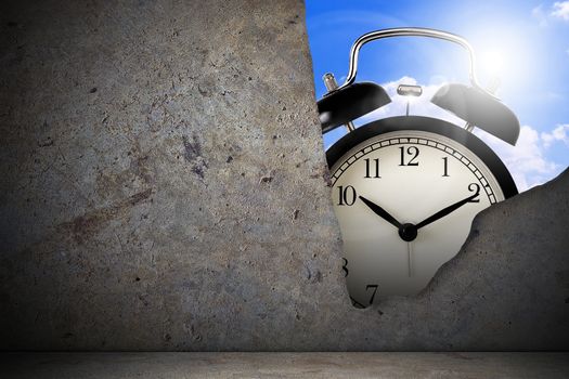 Time management concept, business planning; alarm clock behind crack concrete wall