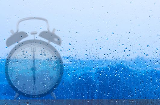 Time management concept, business planning, clock reflection on glass window
